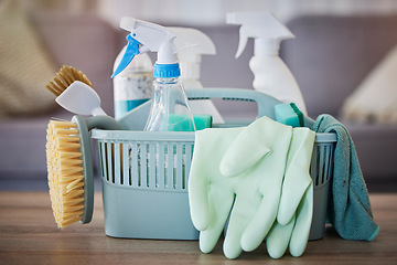 Image showing Cleaning, products and basket on table in home living room for spring cleaning. Hygiene, cleaning supplies and housekeeping equipment for disinfecting, sanitizing or removing germs, bacteria or dust.