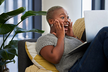 Image showing Laptop, surprise and excited black woman on sofa shocked with win of digital lottery, competition or award. Wow news, prize winner and girl on gambling website play online poker, bingo or casino game