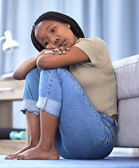 Image showing Black woman, sad or depression in house, home or mental health problem for sad news, grief or loss. Anxiety, burnout or psychology stress for girl in living room, depressed or frustrated with mistake