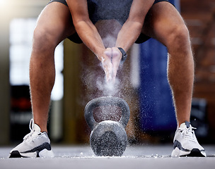 Image showing Man, kettlebell and clapping hands with powder preparing for workout in gym. Sports, fitness or male athlete with weight and chalk dust for grip, training and exercising for muscle, power or strength