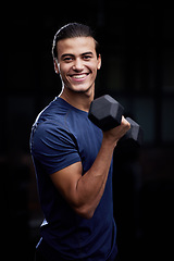 Image showing Bodybuilder man, studio portrait and weightlifting with smile for fitness, muscle development and health. Happy bodybuilding athlete, dumbbell and black background for workout, training and self care