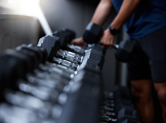 Image showing Man, hands or dumbbells in gym workout, training or exercise for strong muscle growth, healthcare wellness or bodybuilding. Zoom, texture or heavy metal weights for fitness coach or personal trainer