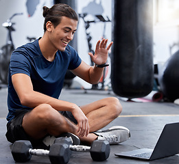 Image showing Man, laptop and wave for video call in gym with smile rest on floor after training session. Guy, wellness and pc break during workout for fitness, health or sport with happiness on online webinar