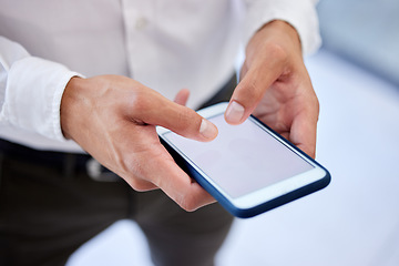 Image showing Phone screen, mockup space or social media while typing hands of a businessman in a office. Zoom hand of worker browsing, send text or sms message or emails while at work with mock up advertising