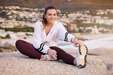 Image showing Fitness, health and woman stretching legs outdoor for flexibility and mobility. Sports, training and portrait of female athlete from Canada getting ready or warm up for cardio, running or workout.