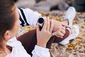 Image showing Fitness, woman and smart watch on mountain hiking, exercise or performance, health and clock. Stopwatch, digital sports technology and hands check progress app, wellness and training time on gps gear