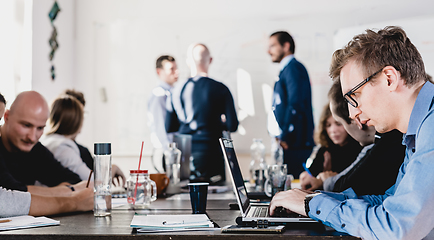 Image showing Relaxed informal IT business startup company team meeting.