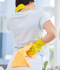 Image showing Neck pain, cleaner and woman with injury in home after working hard. Spring cleaning, housekeeper and female with arthritis, back pain or fibromyalgia after disinfecting, washing or sanitizing house.