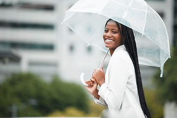 Image showing Fashion, umbrella and city with a walking black woman in the street during a cold rain or wet winter day. Water, portrait and insurance cover for young female for a walk in an urban town or New York