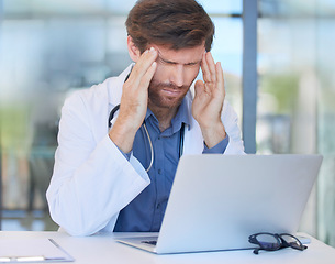 Image showing Headache, burnout and doctor in hospital office feeling pain or migraine while working on laptop. Mental health, anxiety and medical physician from Canada with stress or depression after surgery fail