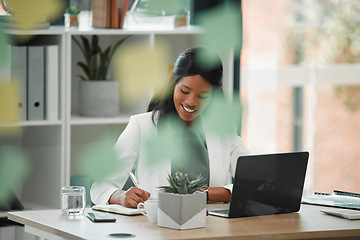 Image showing Working, business woman and employee writing at a office desk for financial management. Black woman, web and computer research of a accounting manager busy with schedule and document planning