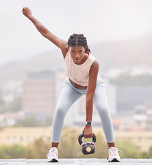 Image showing Woman, portrait and kettlebell fitness outdoors for strength training and bodybuilding routine. Weightlifting, metal equipment and exercising female with bodybuilder goals while lifting heavy