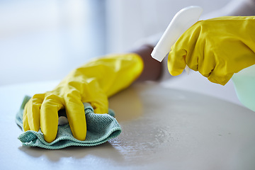 Image showing Cleaning, housekeeping and hands with cloth and spray bottle to wipe, disinfect and clean furniture. Housework, spring cleaning and rubber gloves with detergents, cleaning products and chemical spray