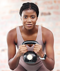 Image showing Exercise, workout and black woman with kettle ball for strength, health or wellness. Sports, fitness and face portrait of female athlete from Nigeria with weight for lifting, training and exercising.