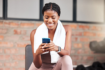 Image showing Black woman, smartphone and exercise in gym, connection and social media. Jamaican female, athlete and phone for communication, relax and break after fitness, workout and training for health or smile