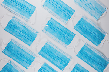 Image showing Medical masks on the blue colored background