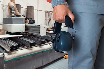 Image showing Worker with headphones