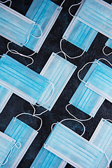 Image showing Medical masks on the blue colored background