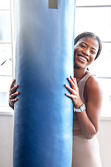 Image showing Fitness, sport and boxing portrait with a woman holding a punching bag in a boxing gym for strength. Exercise, training and happy face of a martial arts fighter taking a break from kickboxing