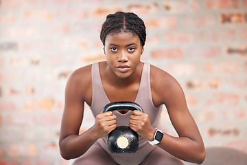 Image showing Black woman, face and kettlebell in gym workout, training or exercise for body muscle growth, cardiology wellness or healthcare. Portrait, sports fitness and personal trainer weightlifting in Jamaica