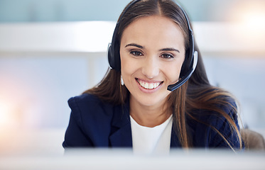 Image showing Crm, contact us or woman in a telemarketing call center consulting, communication or helping with loan advice. Finance, smile or happy employee talking, conversation or speaking to client for sales
