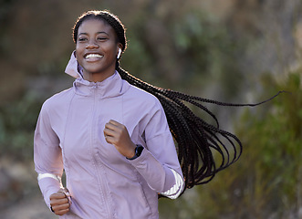 Image showing Running, happy and black woman with music in nature, cardio fitness and sports health in mountains of Indonesia. Podcast, training and African athlete listening to radio while on a run in a park