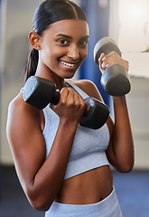 Image showing Fitness, Indian woman and dumbbell training portrait in gym for workout training, exercise motivation and healthy lifestyle. Sports wellness, muscle bodybuilder and athlete woman happy in health club