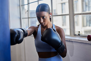 Image showing Boxing, woman and music for fitness motivation with audio podcast for boxer competition, boxing gloves and exercise training in gym. Sports workout, streaming radio and athlete focus for fist fight