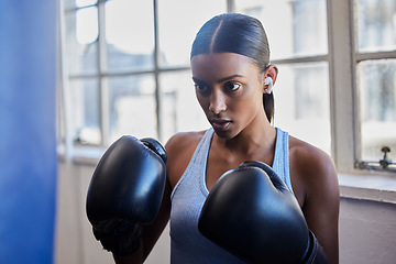 Image showing Boxing, fitness and Indian woman in gym for training, exercise and kickboxing lesson. Sports, wellness and female athlete with boxing gloves for focus, determination and motivation for strong muscles