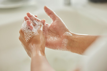 Image showing Woman, cleaning and hands with soap, bubbles or water in bathroom for hygiene, healthcare or safety. Hand washing, foam and clean from germs, virus or bacteria for wellness, healthy skin or self care