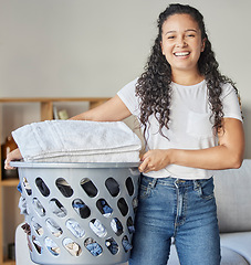 Image showing Woman, portrait and laundry basket for cleaning and folding of clothing with happiness at home. Chores, washing and face of happy female with housework for tidy and clean clothes routine