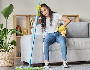 Image showing Cleaning, tired and mop with woman in living room for housekeeping, hygiene or disinfection. Pain, exhausted and fatigue with girl cleaner resting after domestic and tidy for dirt, bacteria or dust