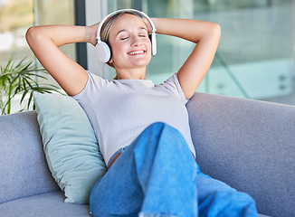 Image showing Music, headphones and woman relax on sofa in home living room streaming radio or podcast. Meditation, zen and female from Canada on couch in lounge listening to audio, song or sound in house alone.