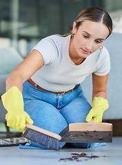 Image showing Cleaning, dust and sweeping with woman on floor of living room for housekeeping, hospitality and hygiene. Dirt, messy and trash with girl cleaner and hand broom at home for domestic, maid and tidy