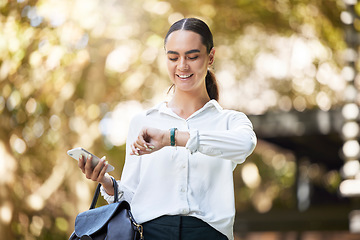 Image showing Business woman, watch and phone in park for time management, travel schedule and appointment in city. Happy female worker check wristwatch time while waiting for taxi commute outdoors with smartphone