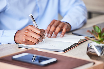 Image showing Business, man and writing in a notebook to plan a corporate strategy and ideas for development. Book, write and hand on paper to develop a professional idea while brainstorming at his desk