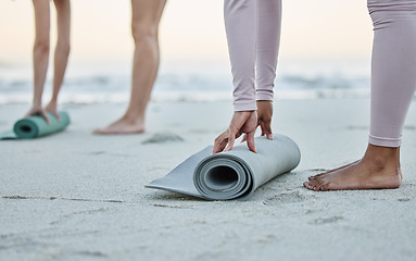 Image showing Yoga, mat and beach with a woman athlete on the coast by the sea or ocean for fitness and exercise. Hands, earth and water with a female yogi training on the shore for wellness ot mental health
