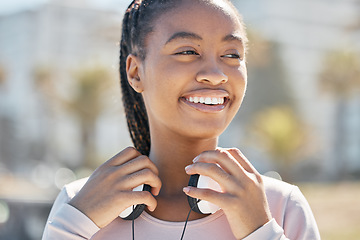 Image showing Start, fitness or black woman with headphones in nature or park ready for training, exercise or workout in Miami. Sports, healthy or happy girl athlete smiles before running outdoors in summer alone