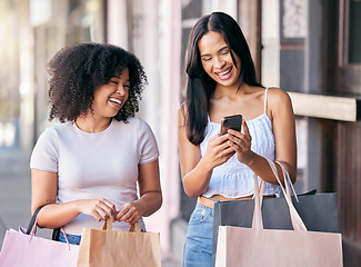 Image showing Women or friends shopping, smartphone and city street on website, mobile app or social media promotion, sale or discount for retail fashion. e commerce, fintech and customer people with shopping bag