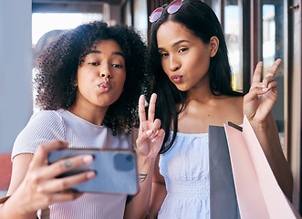 Image showing Selfie, peace and shopping with black woman friends posing for a phone photograph outdoor in the city together. Mobile, hand sign and pout with a female customer and friend in a mall or retail store