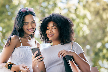 Image showing Women, phone or online shopping in Paris with shopping bags for research, luxury store location or comic brand blog. Happy, smile of friends in happiness for online sale, deal or mobile app discount