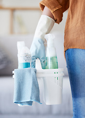 Image showing Hands, cleaning detergent and spray bottle, container and cleaning service for bacteria, glove and product in home. Cleaner, basket and housekeeper working, service and chemical in house with woman