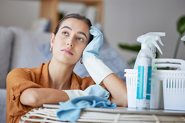 Image showing Cleaning woman, thinking and bored while doing housekeeping, sanitation and disinfection of dirt, bacteria and dust in a house. Face of a lazy cleaner or maid doing maintenance with dreams and goals