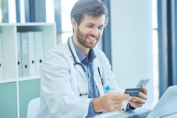 Image showing Doctor, phone and credit card for online shopping, ecommerce and making payment for life insurance, healthcare and medical supplies. Happy male using technology for internet banking and investing