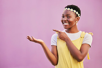 Image showing Face portrait, black woman and pointing at mock up for marketing, advertising or promotion on a studio background. Product placement, branding and happy female model from Nigeria showing copy space.
