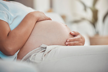 Image showing Pregnant, stomach and woman with hands, pregnancy and prenatal healthcare, maternity leave and family home. Pregnant woman, hope for healthy newborn baby with mom and wellness, motherhood and relax.