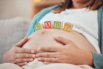 Image showing Pregnant woman, baby toys and hands on stomach for love and care of insurance at home to relax and rest while waiting for birth announcement. Mother excited during pregnancy with gender reveal toys