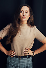 Image showing Woman, fashion portrait and funny face in studio with black background, happiness or beauty in Istanbul. Model, clothes and stylish for comic facial expression, pout lips or happy by dark background