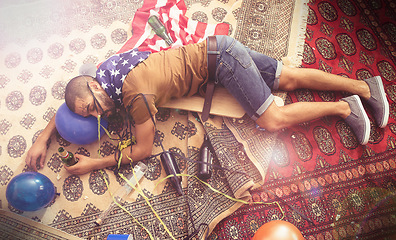 Image showing Party, drunk and sleeping man after new years, social or drinking holiday event on a home carpet. Alcohol, celebrate and hangover of a tired person holding a beer bottle drink with addiction problem