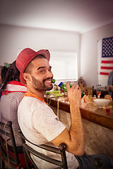 Image showing Portrait, man and beer at house party, room and college dormitory in USA for new year celebration, fun and freedom. Happy guy, drinking alcohol bottle and celebrate with social friends in apartment